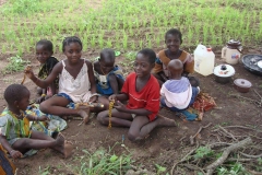 Children-playing-games-while-mamies-are-weeding.-Togo